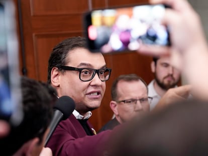 Rep. George Santos, R-N.Y., talks to reporters as House Republicans hold a caucus meeting at the Capitol in Washington, Friday, Oct. 13, 2023