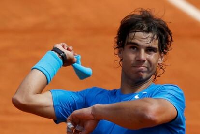 Nadal launches a sweatband into the Parisian crown after securing his place in the last eight.