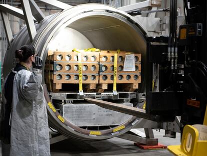 In this image released by the U.S. Army, an operator guides a forklift driver to unload VX nerve agent M55 rockets on April 15, 2022, at the Blue Grass Army Depot near Richmond, Ky.