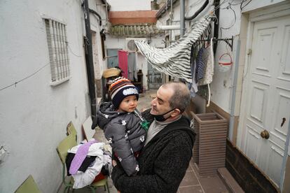Jesús Rico, 49, with his grandson Saúl in one of the courtyards.