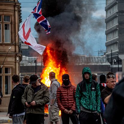 SUNDERLAND, ENGLAND - AUGUST 02: Far-right activists hold an 'Enough is Enough' protest on August 02, 2024 in Sunderland, England. After the murders of three girls in Southport earlier this week, misinformation spread via social media and fueled acts of violent rioting from far-right actors across England. While they prefer to be called 'concerned parents', their actions point to racial hatred with a particular focus on Islamophobia thus targeting mosques. (Photo by Drik/Getty Images)