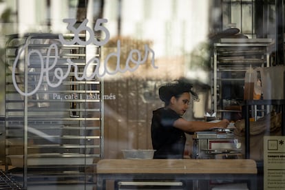 An employee works inside a 365 Obrador establishment on Gran Via, in Barcelona.