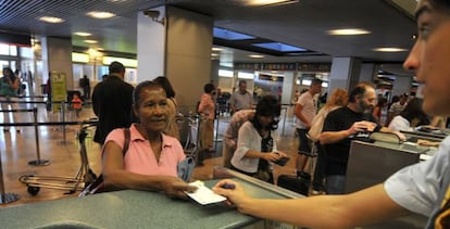 An Ecuadorian immigrant prepares to fly home from Spain after losing her job. 