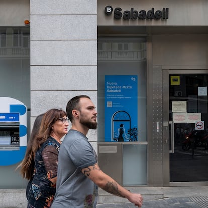 MADRID, SPAIN - 2023/10/25: Pedestrians walk past the Sabadell Bank, a Spanish multinational financial services in Spain. (Photo by Xavi Lopez/SOPA Images/LightRocket via Getty Images)
