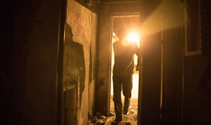 A homeless person sleeps by the emergency exits in the Azca tunnels.