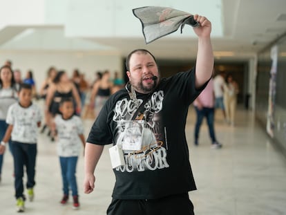 Luis Butti, a guide with autism spectrum disorder leads a tour group at the Corinthians soccer club Neo Quimica Arena in Sao Paulo, Brazil
