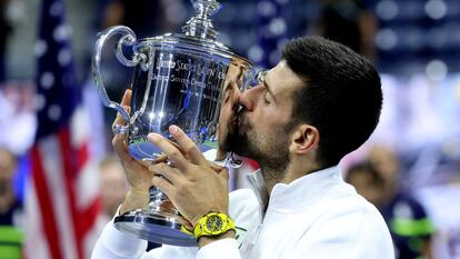 Serbia's Novak Djokovic celebrates with the trophy after winning the U.S. Open.