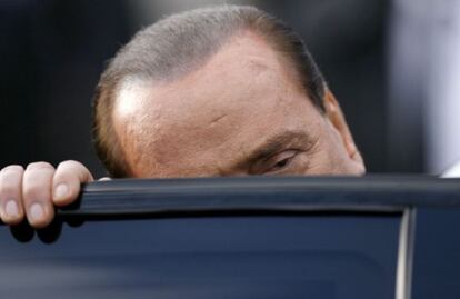 Silvio Berlusconi, antes de entrar a un coche, en 2009.