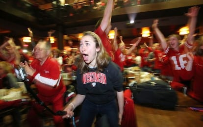 Wisconsin fans celebrate their team’s victory in the semifinals.