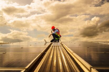 African american engineering are about to checking solar panels. Electrical and instrument technician use laptop to maintenance electric solution