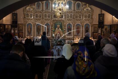 Ukrainians attend a Christmas mass at an Orthodox Church in Bobrytsia, on the outskirts of Kyiv, Ukraine, on Dec. 25, 2022.