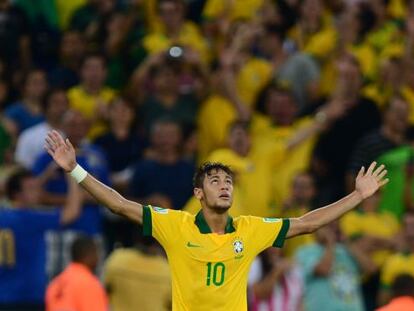 Brazil&#039;s forward Neymar celebrates after scoring against Spain during their FIFA Confederations Cup Brazil 2013 final match.