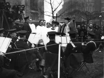 British composer Ethel Smyth conducts a band performance at an event honoring suffragette leader Emmeline Pankhurst; London, 1930.