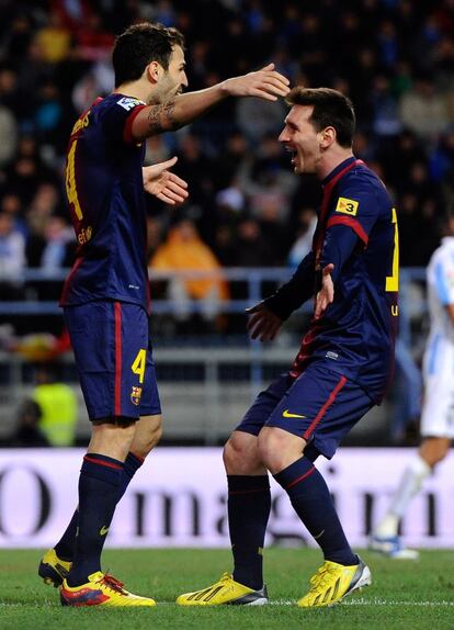 Cesc y Messi celebran el segundo gol.