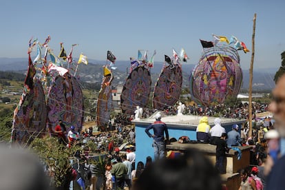 The children are in charge of holding the large kites that are used on All Souls' Day in Guatemala.