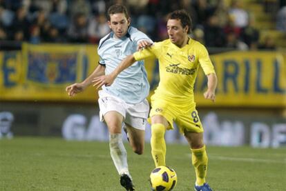 Santi Cazorla junto a Juan Luís, del Poli Ejido.