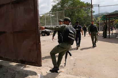 A soldier closes the main gate of the Tocorón penitentiary during a military intervention, in Tocorón, Venezuela, on Sept. 20, 2023. 