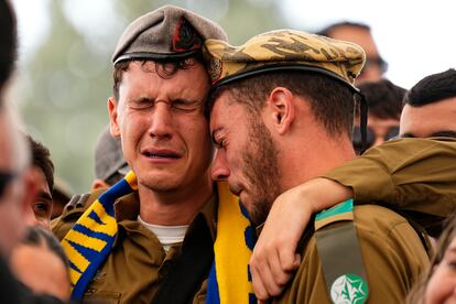 Soldiers and friends of Israeli soldier, Sergeant Dolev Malca, mourn in grief during his funeral in Shlomi, northern Israel, on the border with Lebanon, Sunday, March 3, 2024.