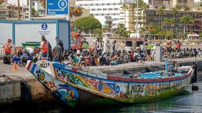 Migrants in the port of Los Cristianos, in the south of the island of Tenerife. They are pictured next to the boat on which they travelled from Senegal to reach the Canary Islands, on July 4, 2023.