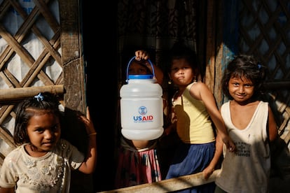 A Rohingya refugee girl holds a jar with USAID logo imprinted, at the refugee camp in Cox's Bazar, Bangladesh, March 16, 2025. REUTERS/Mohammad Ponir Hossain