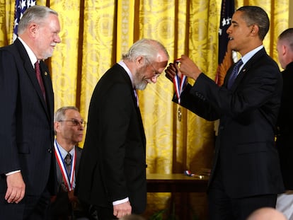 Then-President Barack Obama presents John E. Warnock (center) and Charles M. Geschke (left) with the National Medal of Science in 2009.