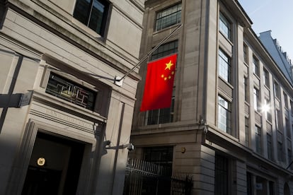 The Chinese national flag hanging in sunshine from the Bank of China's headquarters, on 13th February 2017, in the City of London, United Kingdom.