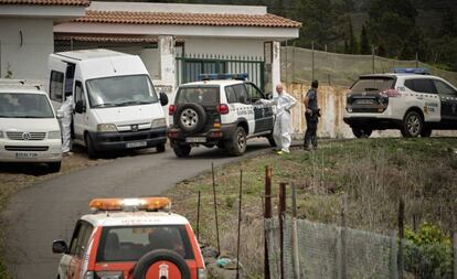 Civil Guard officers on the road near the cave where the bodies were found.