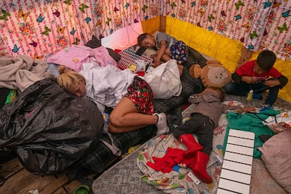 Nayleth, from Caracas, and her children sleep in a migrant camp in Mexico City.