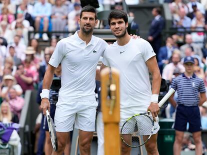 Serbia's Novak Djokovic, left, and Spain's Carlos Alcaraz pose for a photo ahead of the final of the men's singles on day fourteen of the Wimbledon tennis championships in London, Sunday, July 16, 2023.