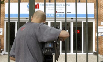 A news camera films outside the Carlos III hospital in Madrid.