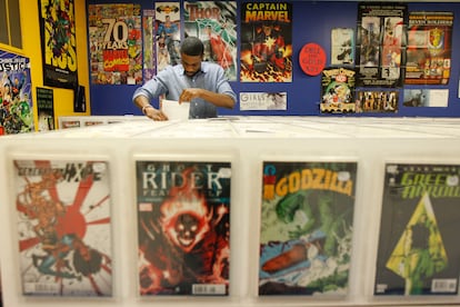 A client in a Philadelphia comic specialty shop checks out back issues on Free Comic Book Day, on may 4th 2012.