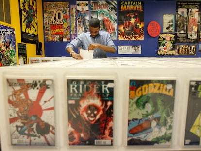 A client in a Philadelphia comic specialty shop checks out back issues on Free Comic Book Day, on may 4th 2012.