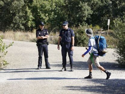 Police officers stationed along the Camino de Santiago.