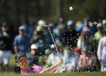 Paul Casey hits from a bunker on the 17th hole during the fourth round at the Masters golf tournament Sunday, April 8, 2018, in Augusta, Ga. (AP Photo/Charlie Riedel)