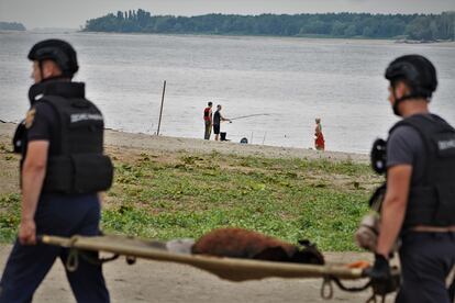 Emergency services remove a bomb from the Dnipro River near the southern Ukrainian city of Zaporizhzhia.
