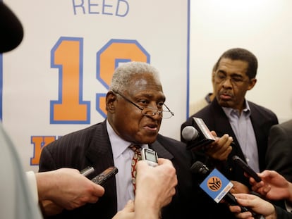 New York Knicks Hall-of-Famer Willis Reed responds to questions during an interview before an NBA basketball game between the Knicks and the Milwaukee Bucks in April 2013.