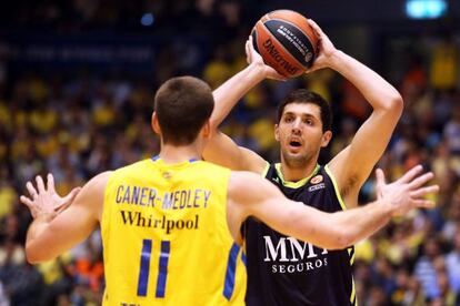 Real Madrid Nikola Mirotic&#039;s vies with Nik Caner Medley of Maccabi Electra in Tuesday&#039;s Euro League match. 