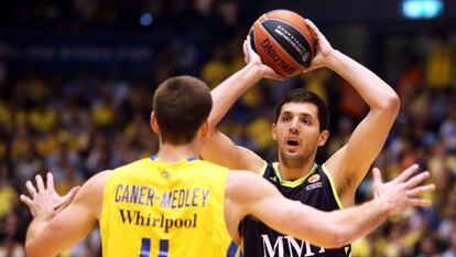Real Madrid Nikola Mirotic's vies with Nik Caner Medley of Maccabi Electra in Tuesday's Euro League match.