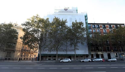 The building (concealed by a construction screen) where Mansur bought a luxury home.