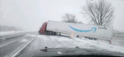 In this photo provided by Nebraska State Patrol, a tractor trailer veers into ditch on Christmas Day on Interstate 80 in Nebraska as a winter storm pummels part of the Midwest.