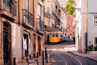 A trolley traverses Lisbon's Alfama district.