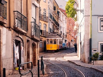 A trolley traverses Lisbon's Alfama district.