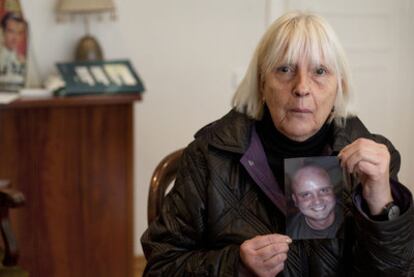 Dolors Barril holds up a photograph of her son.