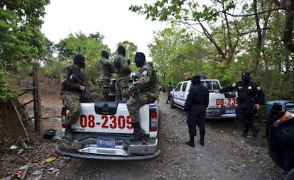 Soldiers and police patrol San Salvador on Saturday.