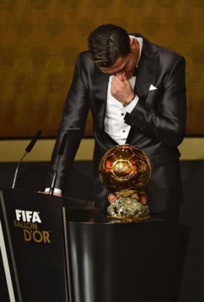 A tearful Cristiano Ronaldo takes his prize on Monday.