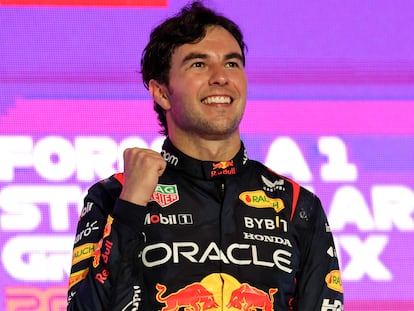 Red Bull Racing's Mexican driver Sergio Perez celebrates on the podium after winning the Saudi Arabia Formula One Grand Prix at the Jeddah Corniche Circuit in Jeddah on March 19, 2023. (Photo by Giuseppe CACACE / AFP)