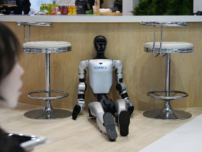 A humanoid robot at the GMO AI & Robotics booth at the Tokyo International Robotics Exhibition