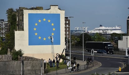 An artwork in the English port city of Dover attributed to street artist Banksy, depicting a workman chipping away at one of the 12 stars on the flag of the European Union.