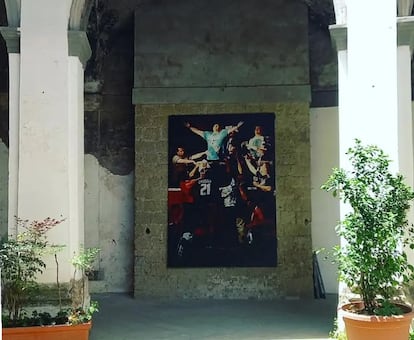 The cloister of the church, with the painting in the background.