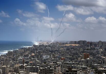 TOPSHOTS
Smoke from rockets fired from near Gaza City is seen after  being launched toward Israel, on July 15, 2014. US Secretary of State John Kerry  warned of the "great risks" that the violence between Israel and the Gaza Strip could spiral out of control.   AFP PHOTO / THOMAS COEX